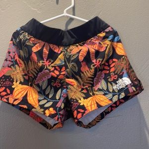 Youth North face shorts. They have a drawstring to tighten if necessary.